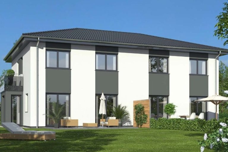 Modernes zweigeschossiges Haus mit grauen und weißen Fassaden im Garten.