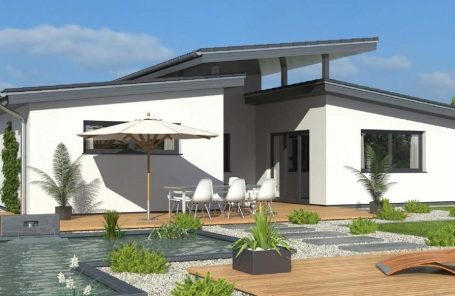 Drevo Fertigbau - Fachberater für Fertighäuser - Thomas Bärtle Moderne Architektur eines Hauses mit Terrasse, Schwimmbad und Sonnenliege.