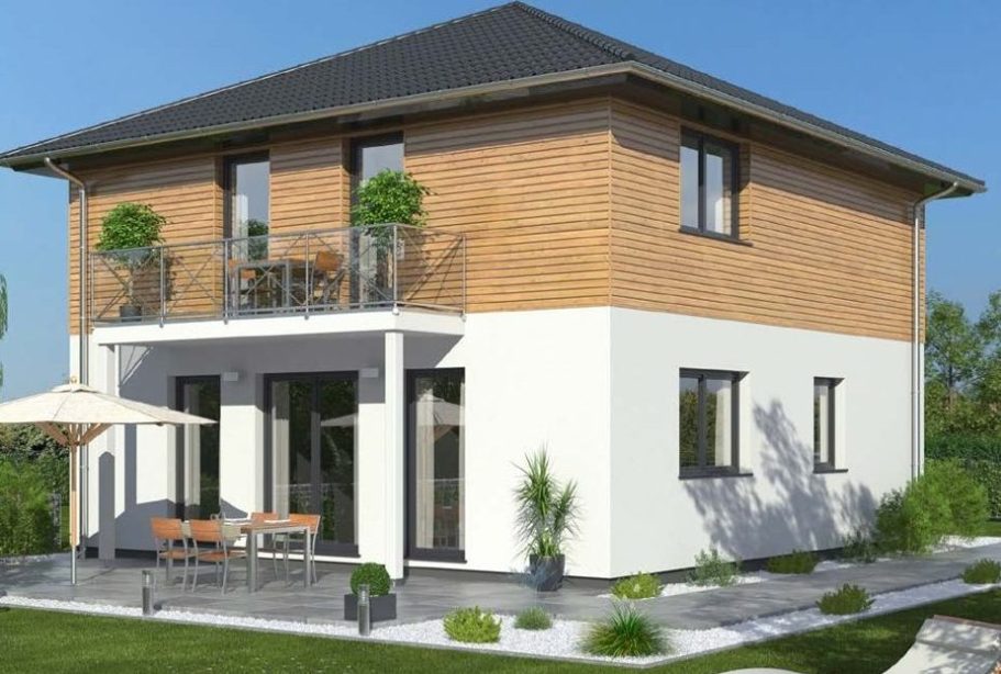 Drevo Fertigbau- Fachberater für Fertighäuser - Thomas Bärtle Modernes zweigeschossiges Haus mit Holz- und Putzfassade, Balkon und Terrasse.